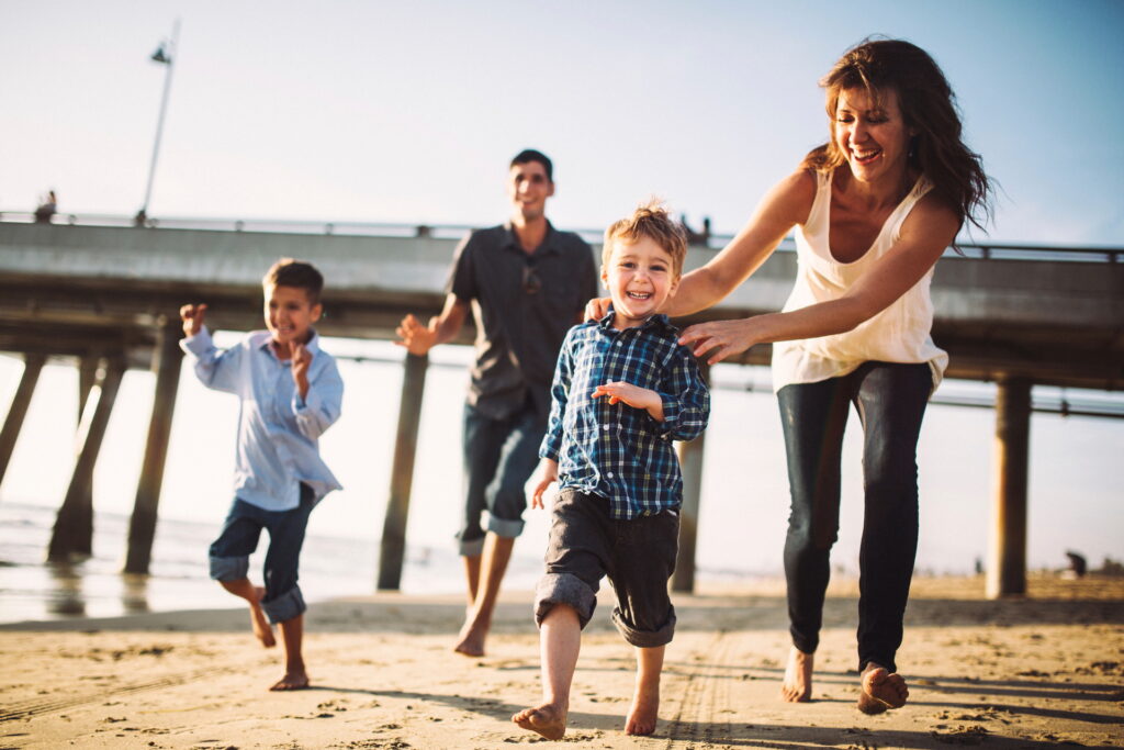 family-running-on-beach